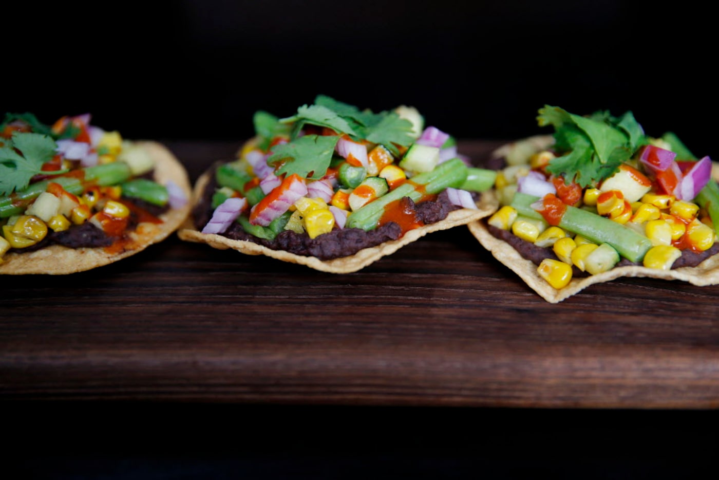 Vegan black-bean tostadas with spring vegetables