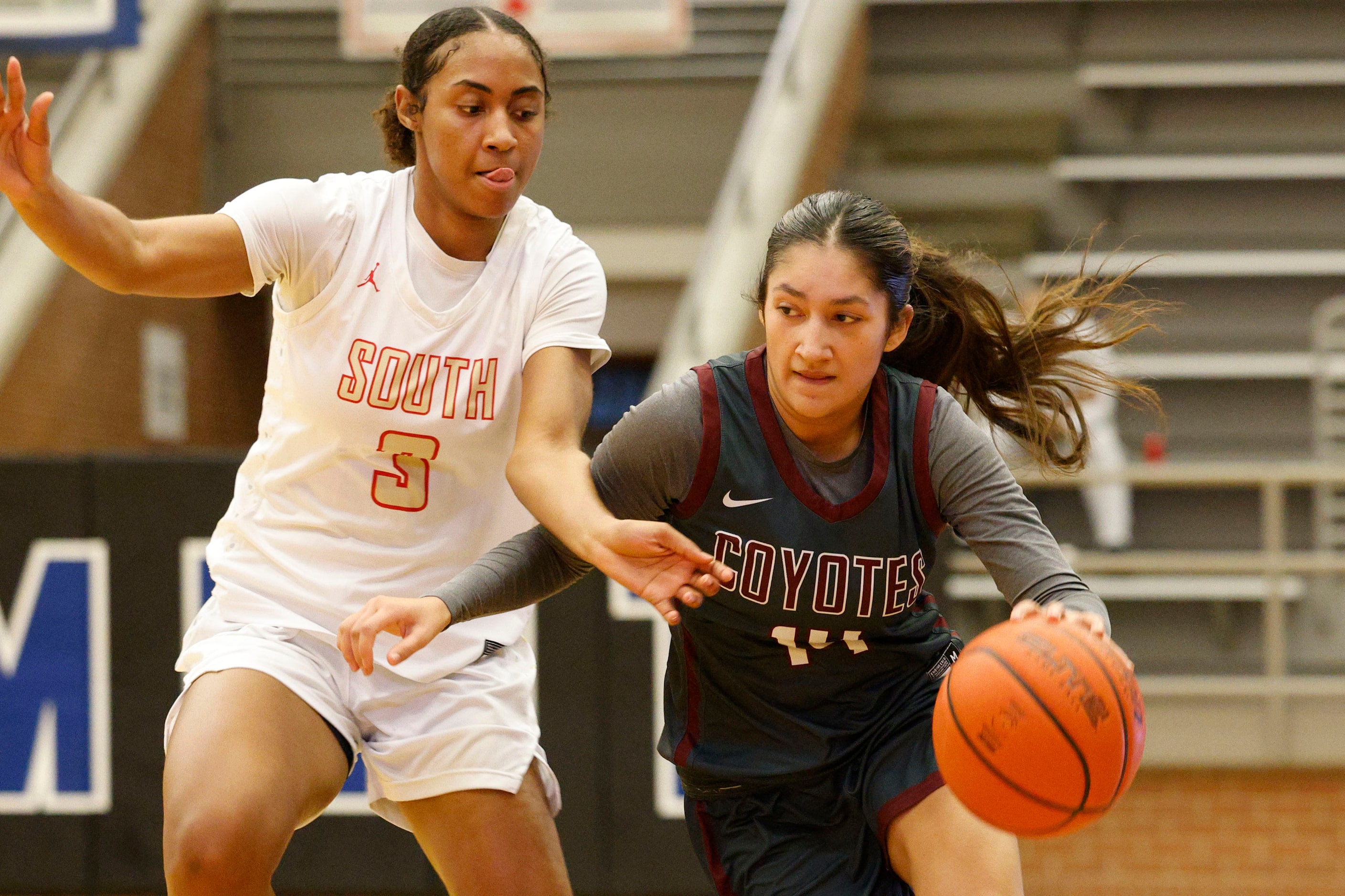 Frisco Heritage's Elyse Mercado (14) tries to drive past South Grand Prairie's Taylor Barnes...