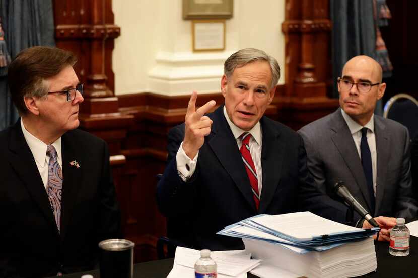 Texas Gov. Greg Abbott (center), with Speaker of the House Dennis Bonnen (right) and Lt....