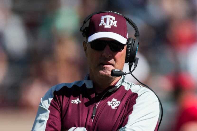 Texas A&M Aggies assistant coach Tim Brewster stands on the field during a Texas A&M...