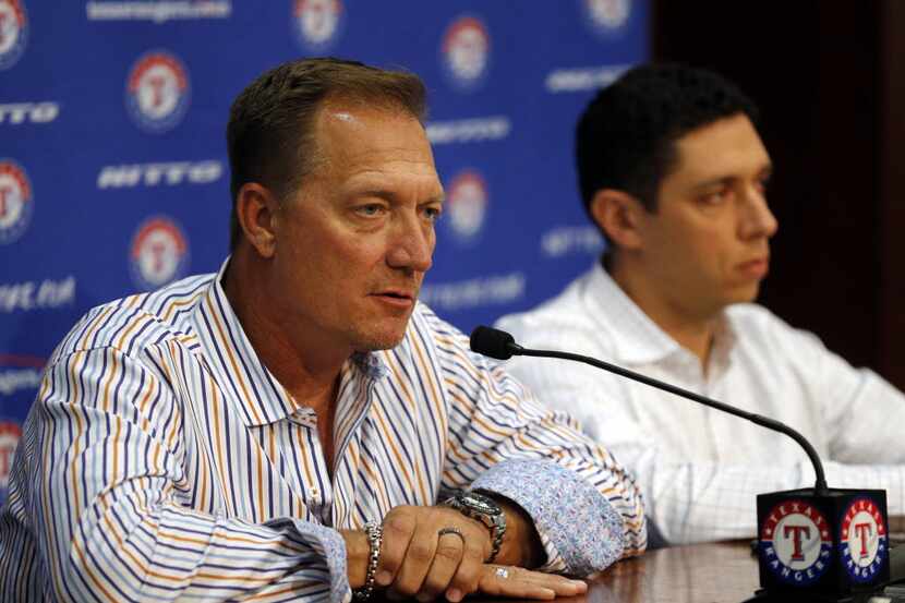 Texas Rangers manager Jeff Banister (left) talks to media as general manager Jon Daniels...
