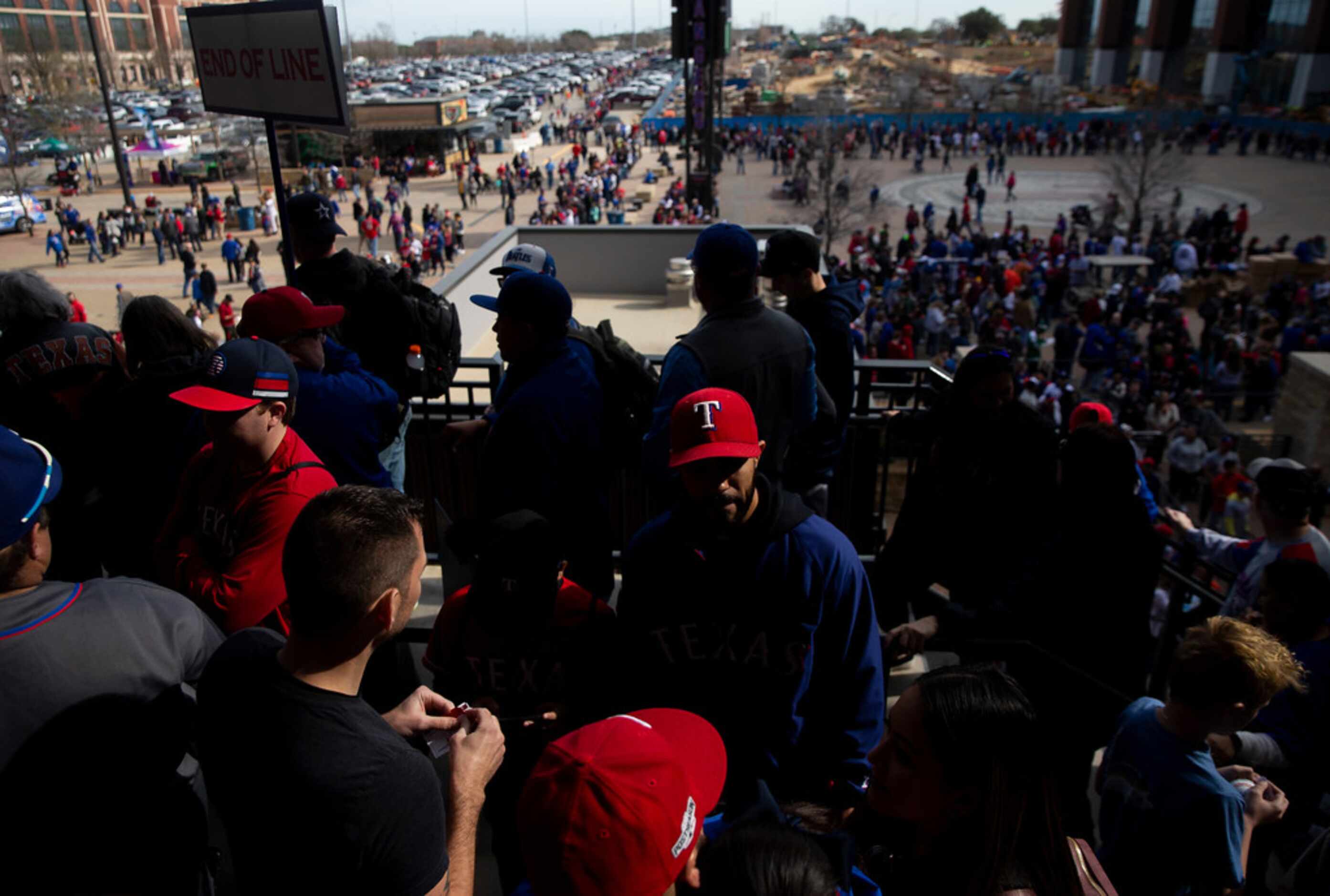 Fans wait in line to meet players during the Rangers' Peek at the Park fanfest on Jan. 25,...