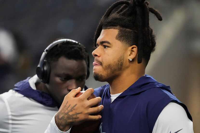 Dallas Cowboys defensive tackle Trysten Hill warms before an NFL football game against the...