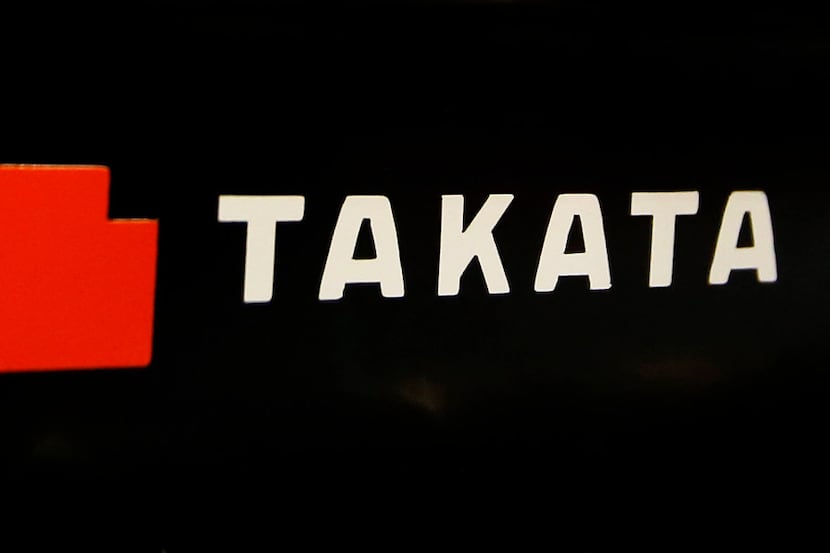 FILE - This July 6, 2016, file photo, shows the logo of Takata Corp. at an auto supply shop...