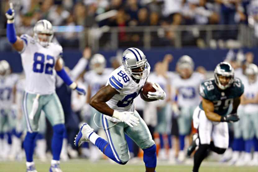 Dallas Cowboys wide receiver Dez Bryant runs in a touchdown during the second half of...