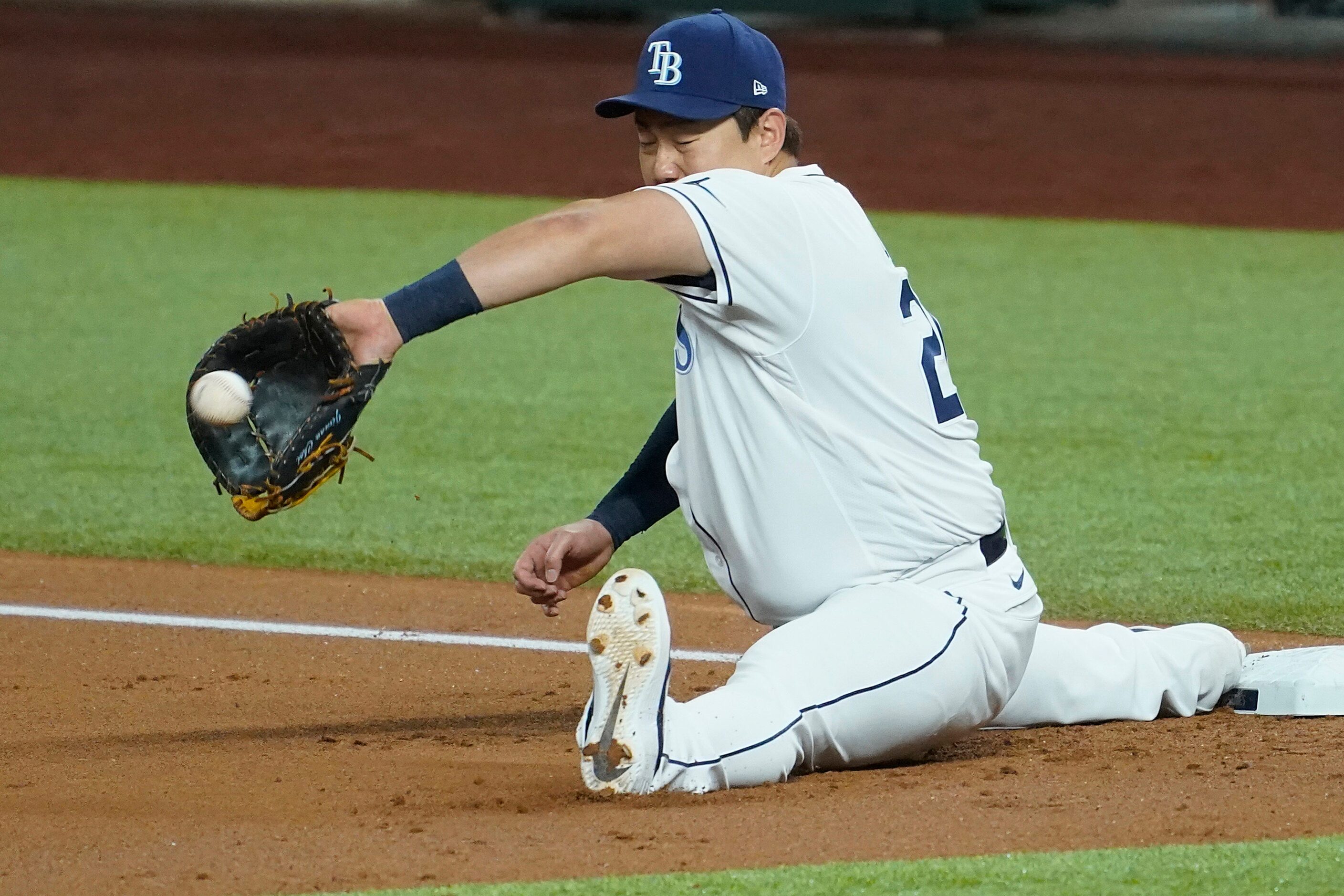 Tampa Bay Rays first baseman Ji-Man Choi stretches to makt a play on a the throw from...