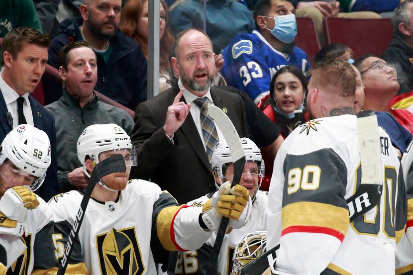 VANCOUVER, BC - APRIL 3: Head coach Peter DeBoer of the Vegas Golden Knights talks to Robin...