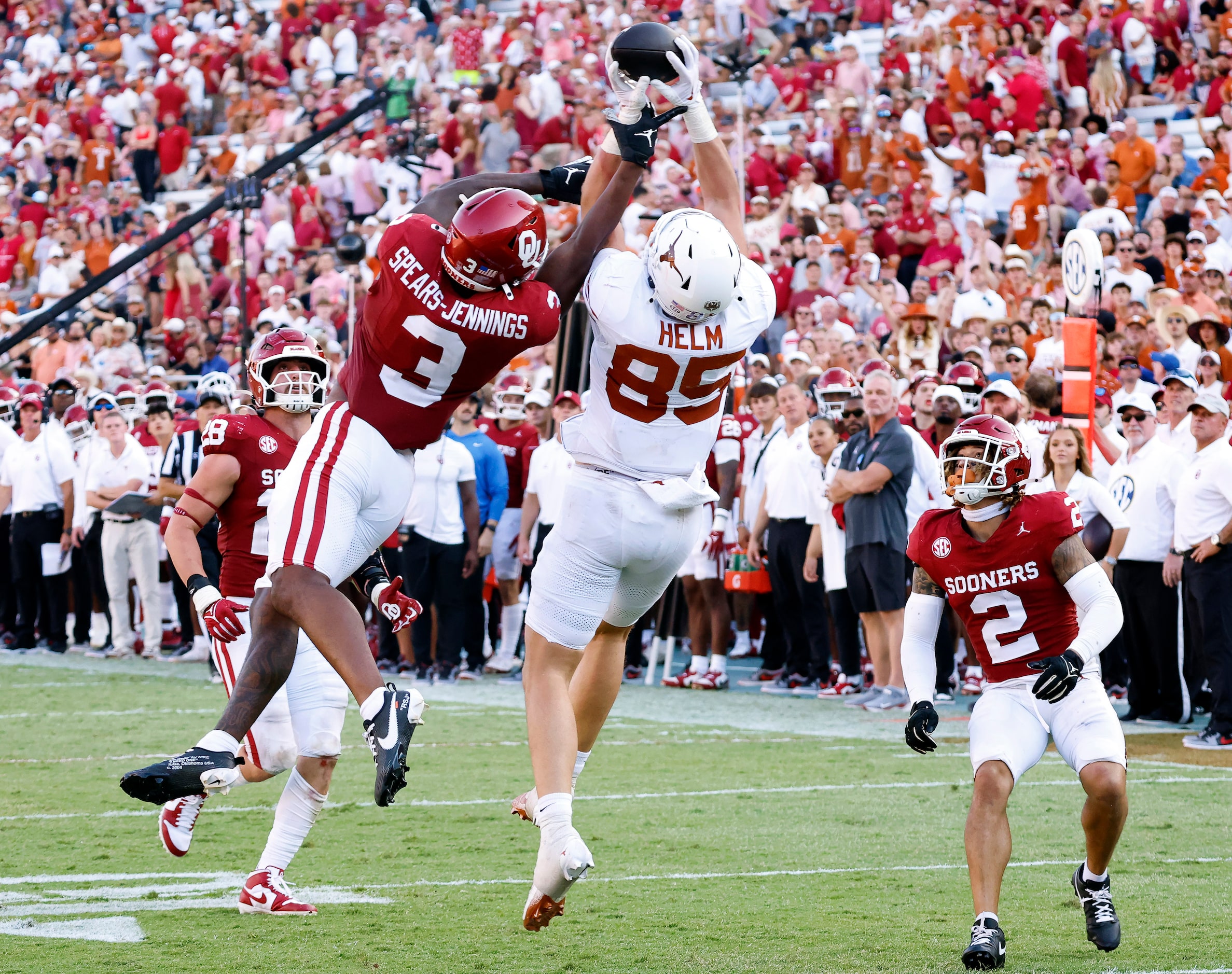 Texas Longhorns tight end Gunnar Helm (85) goes high for a pass completion from wide...