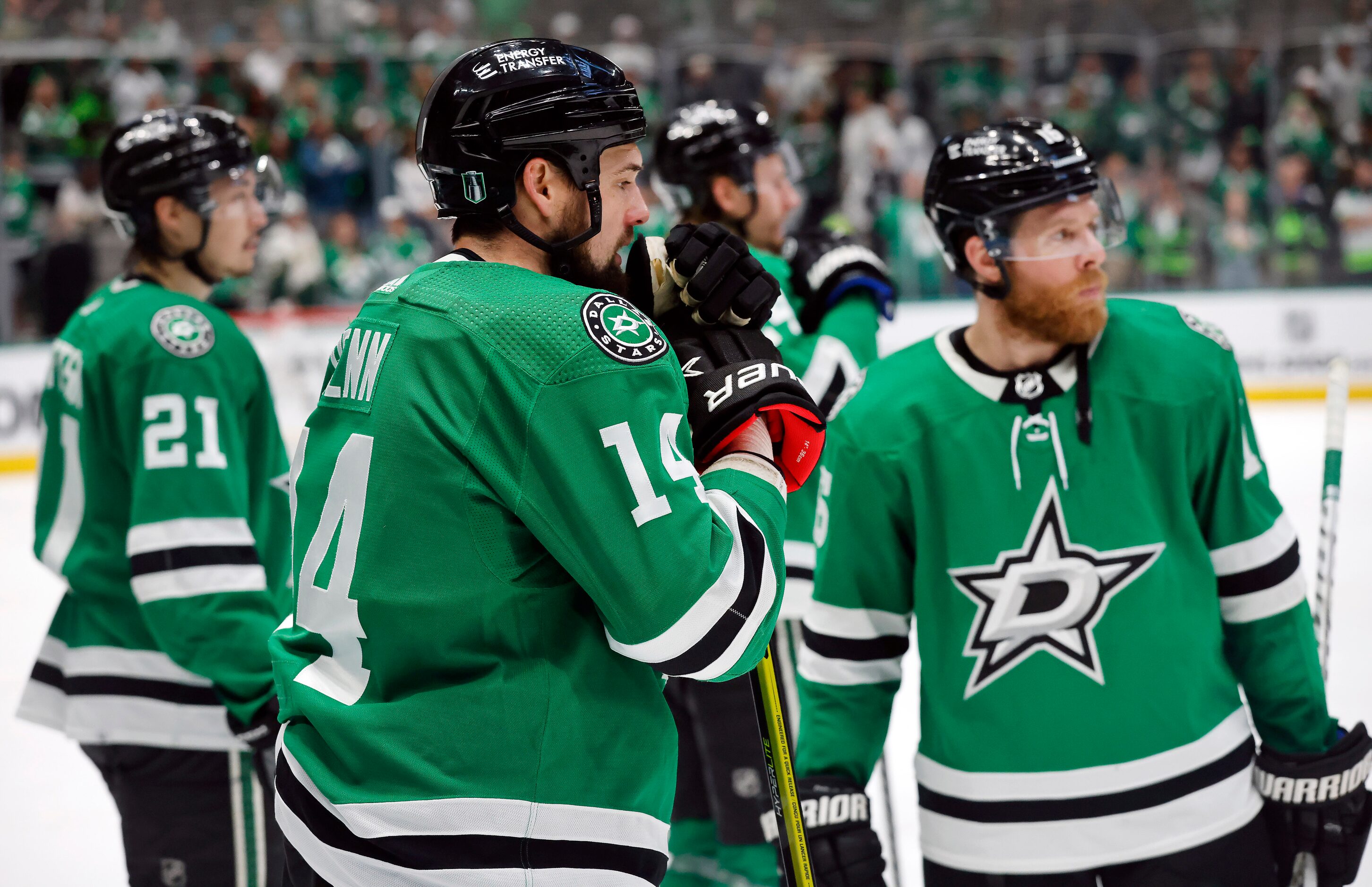 Dallas Stars left wing Jamie Benn (14) and his teammates, Jason Robertson (21) and center...