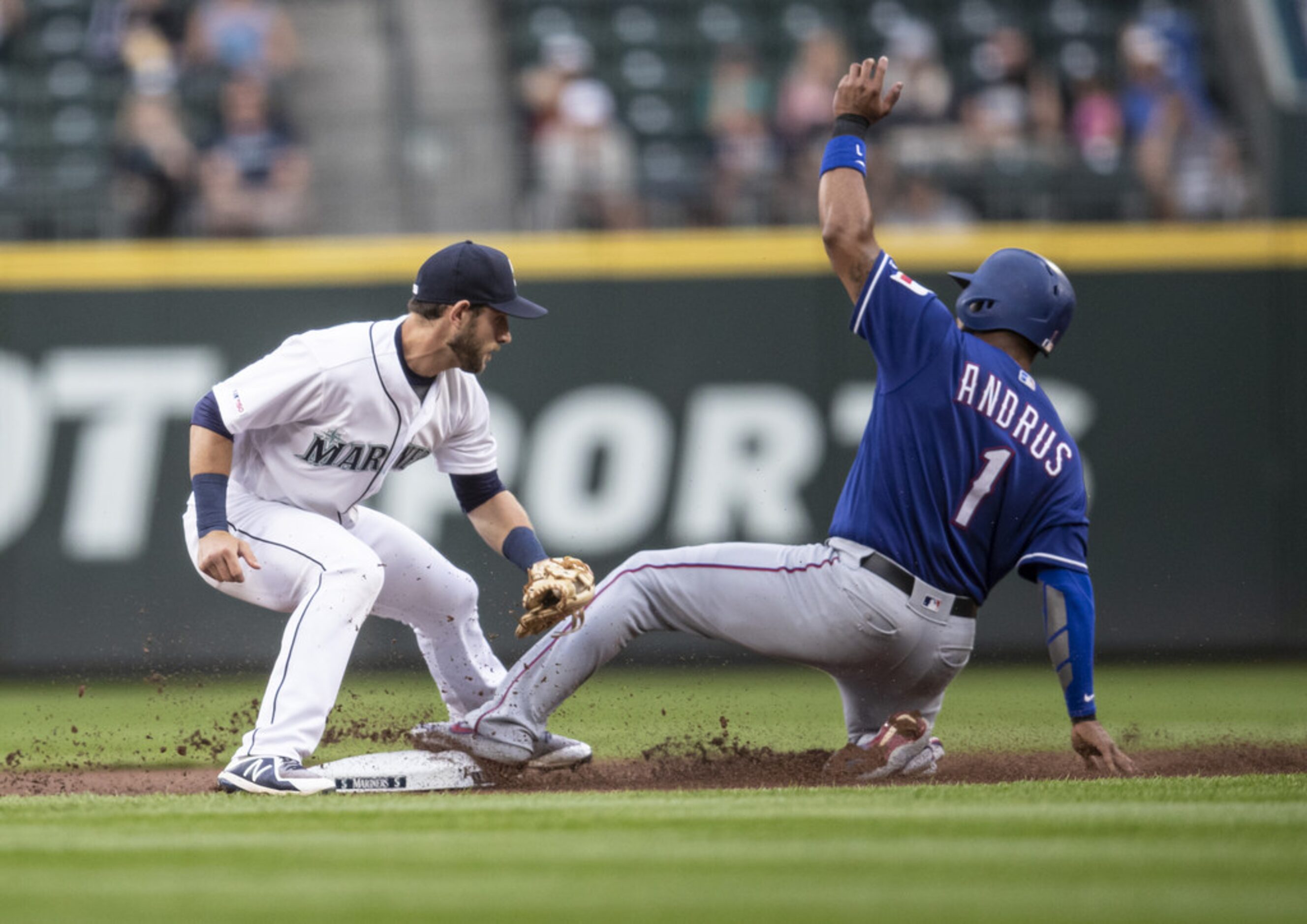 SEATTLE, WA - JULY 23: Elvis Andrus #1 of the Texas Rangers steals second base before second...