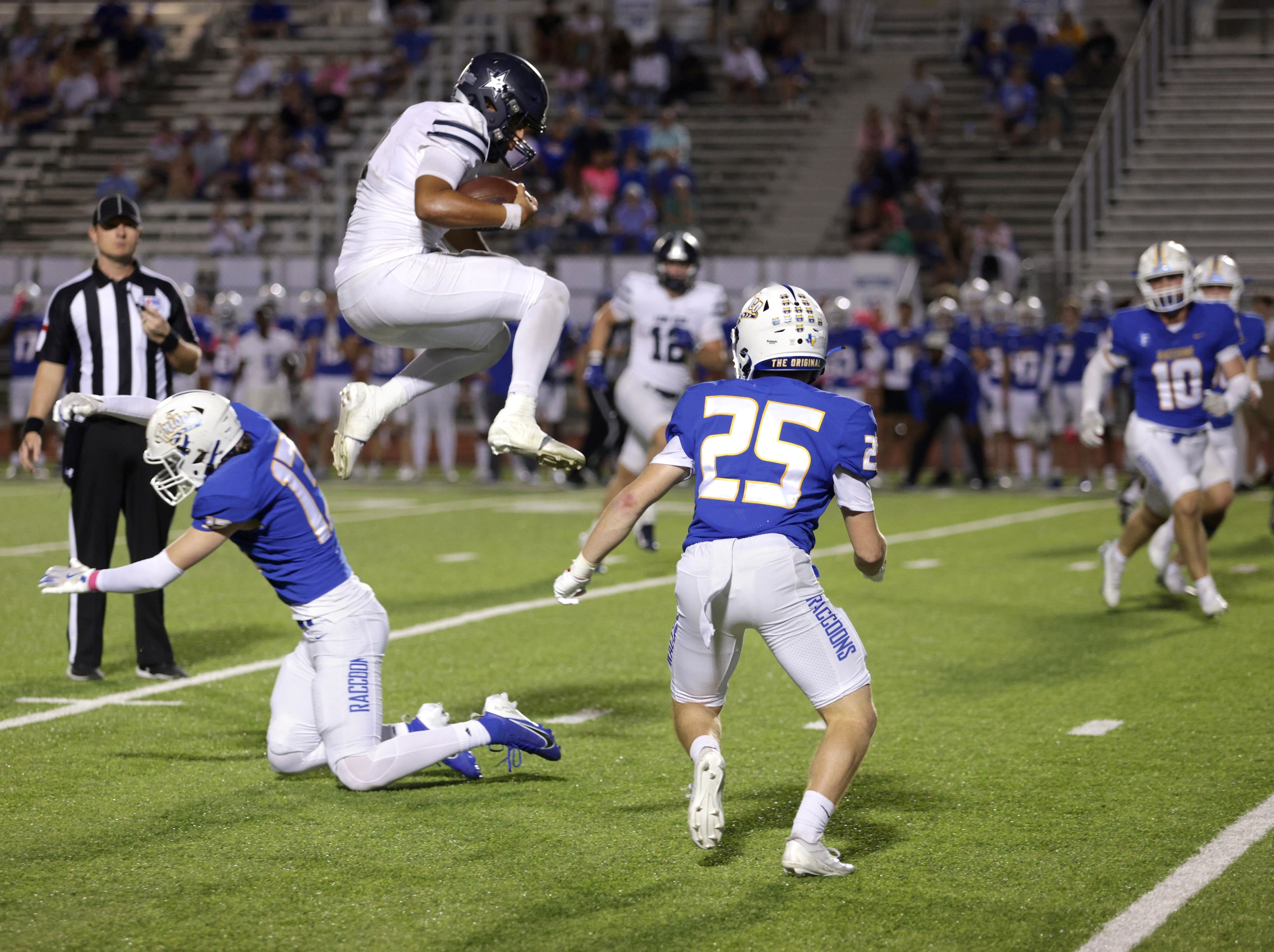 Lone Star player #7 Karece Hoyt jumps over Frisco player #13 Aaron Staley during the Frisco...