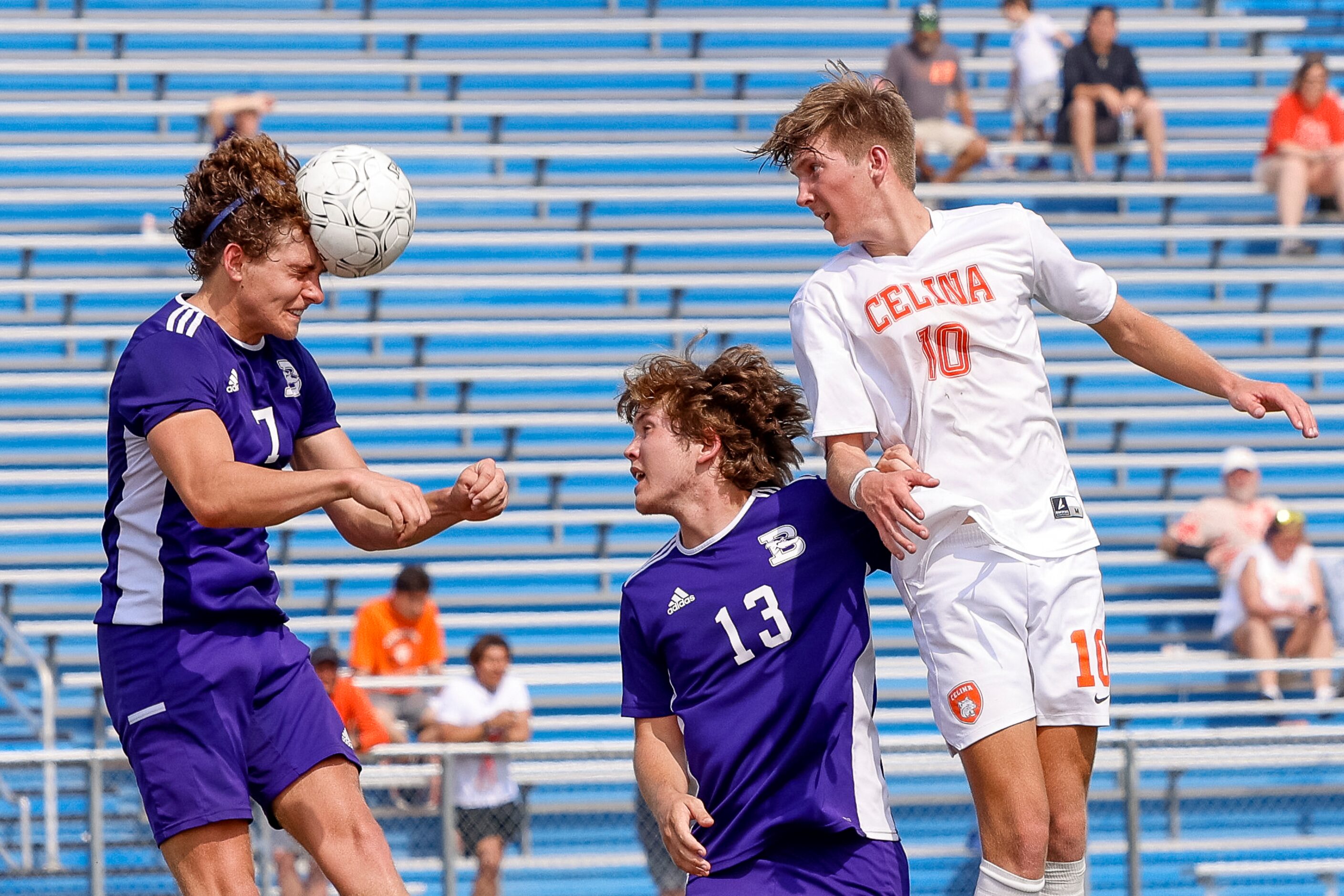 Boerne defender Joe Ballenger (7) heads the ball away from Celina midfielder Kohyn Gough...