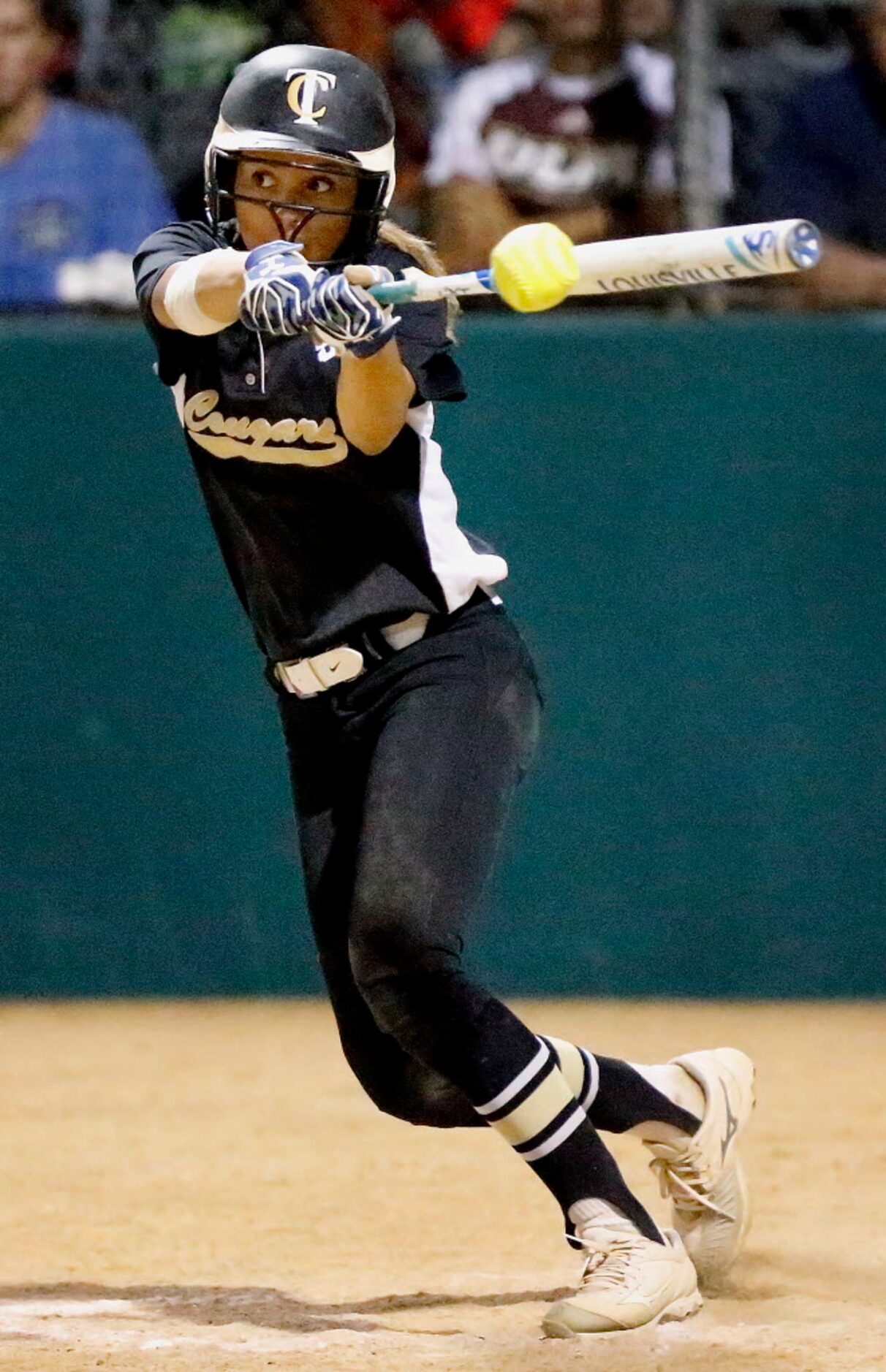 The Colony shortstop Jayda Coleman (24) gets a hit to get on base in the bottom of the...