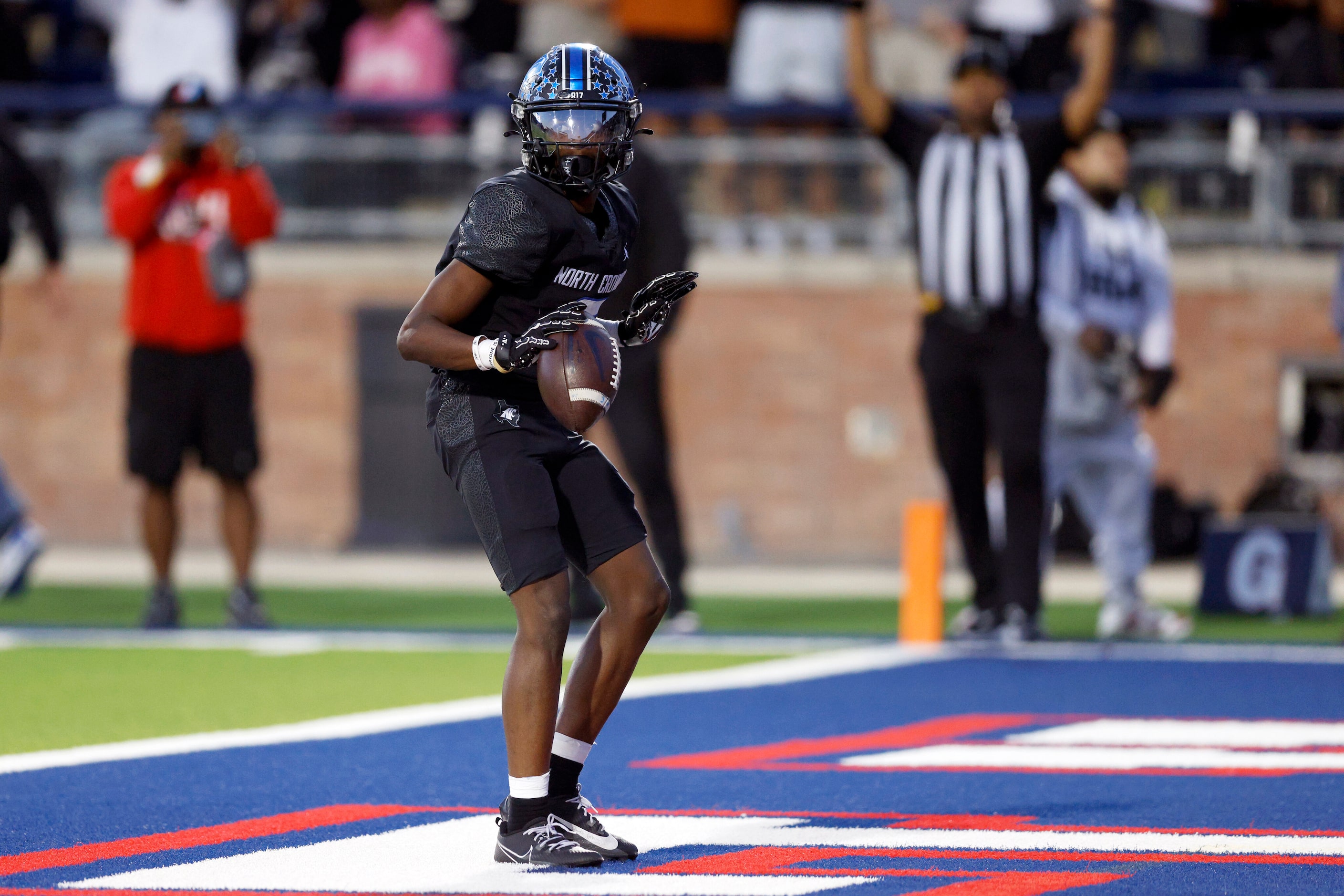 North Crowley wide receiver Quentin Gibson (6) celebrates after a 49-yard touchdown...