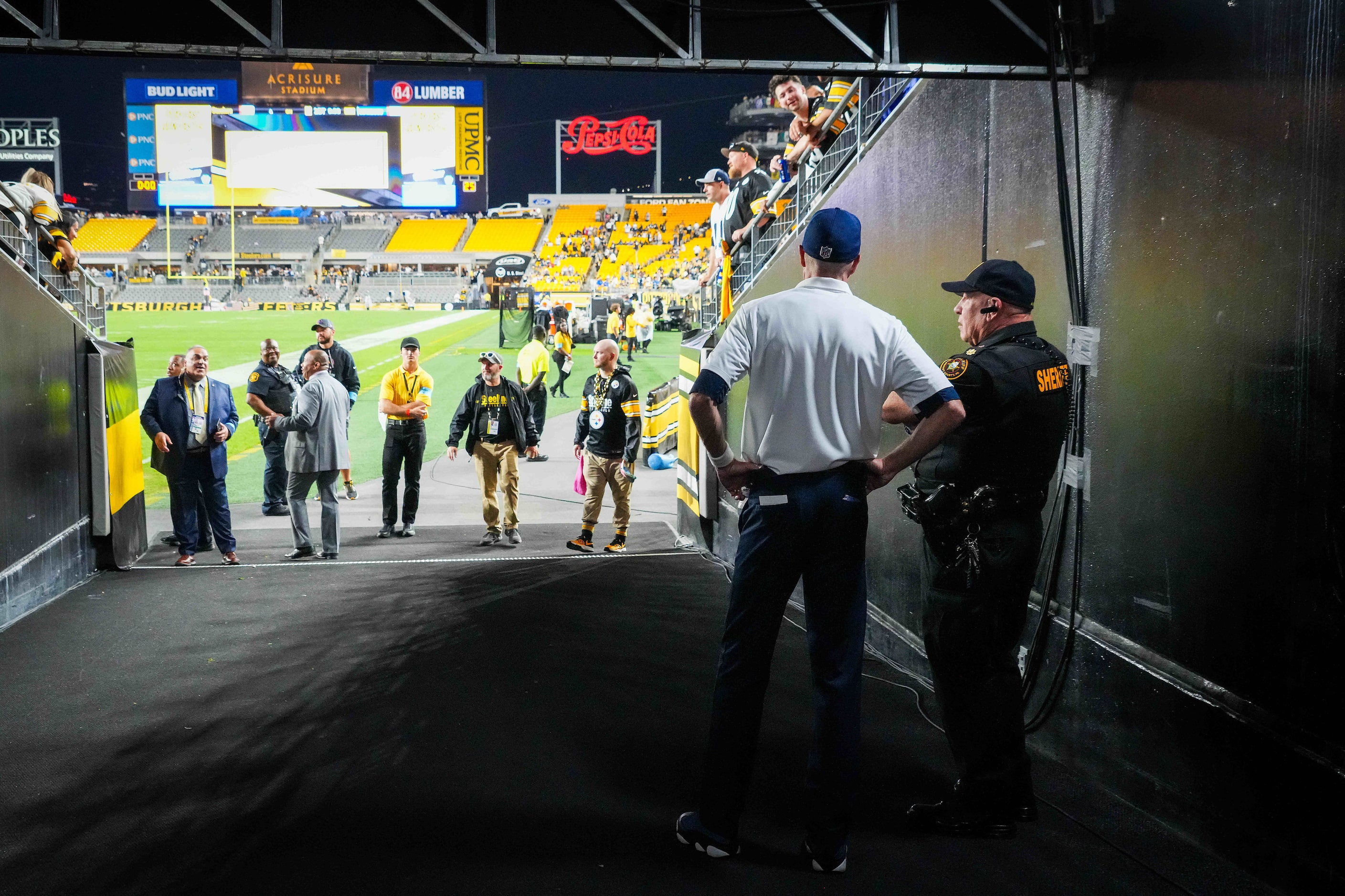 Dallas Cowboys special teams coordinator John Fassel looks out from the tunnel during a...