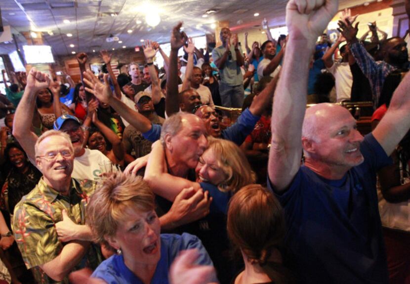 Dallas Mavericks fans at Champps in Addison, Texas erupt with joy when the Mavs won the NBA...