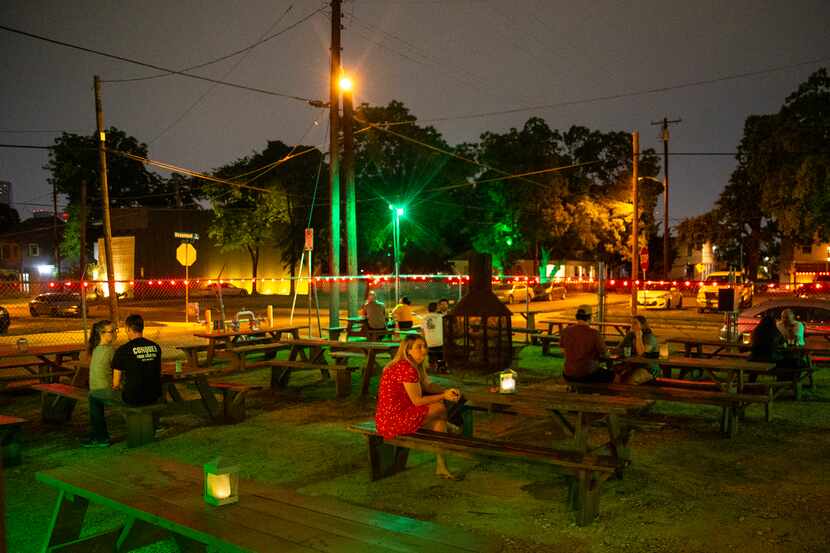 Patrons enjoyed the outdoor seating area at Lee Harvey's in Dallas' Cedars neighborhood Friday.