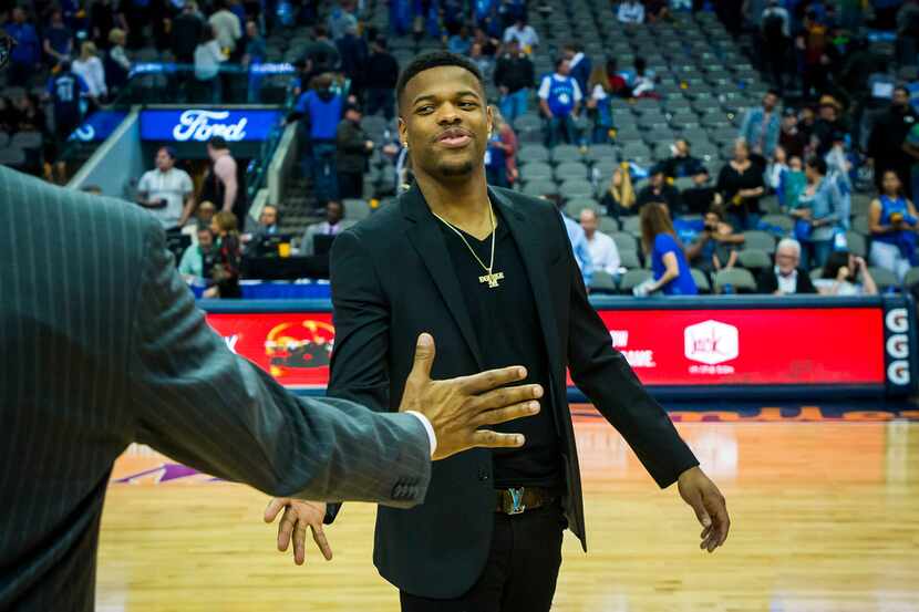 Dallas Mavericks guard Dennis Smith Jr. walks off the court following a 124-97 loss to the...