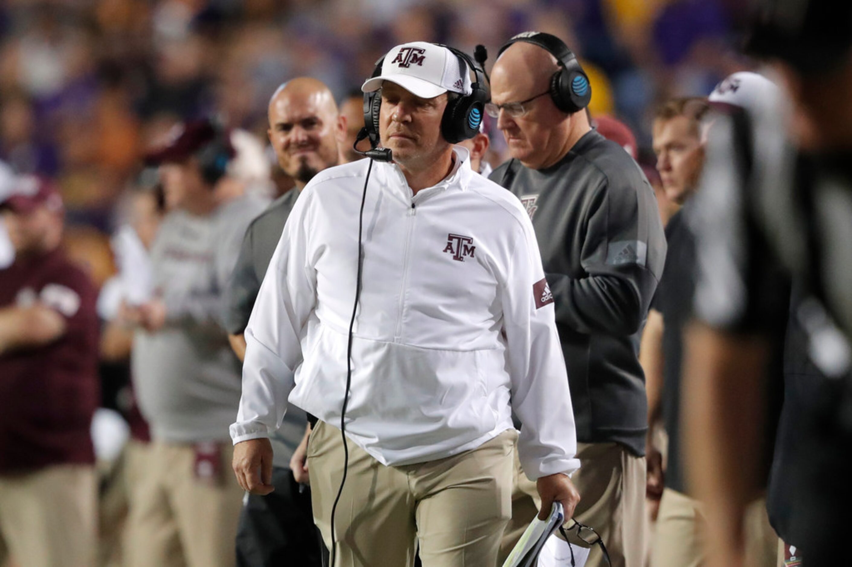 Texas A&M coach Jimbo Fisher walks along the sideline during the first half of the team's...