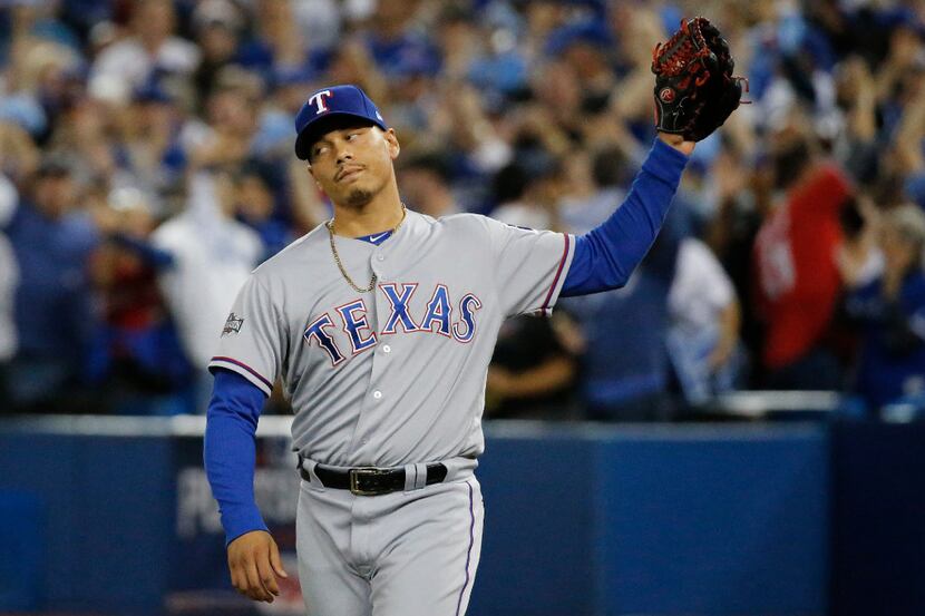 FILE - Texas Rangers relief pitcher Keone Kela (50) reacts after the Blue Jays tied the...