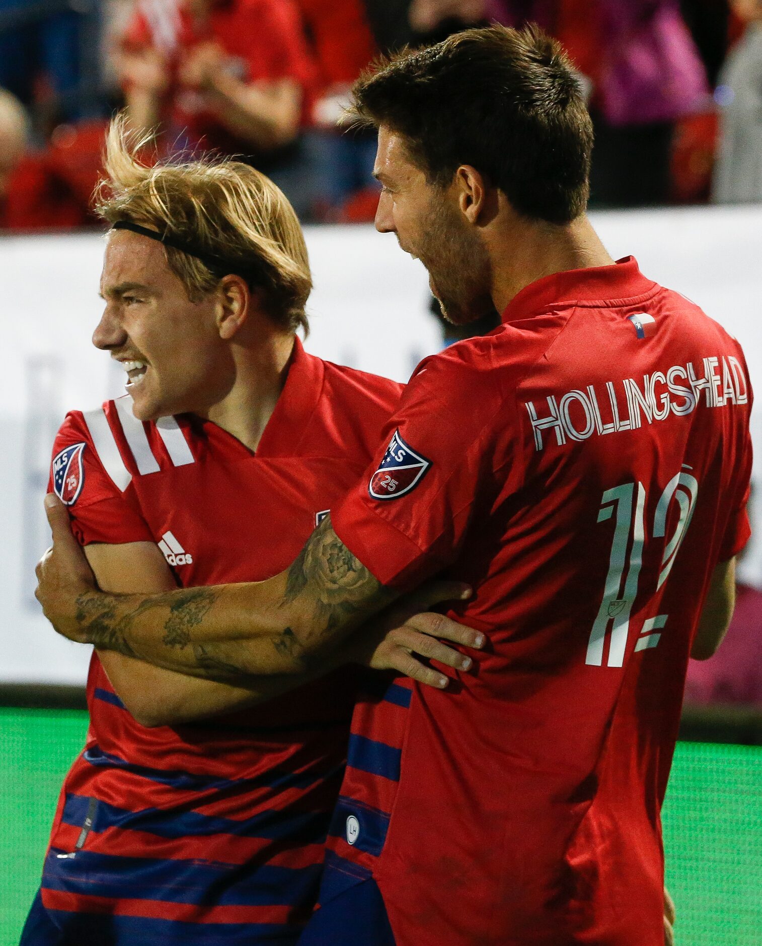 FC Dallas midfielder Paxton Pomykal (19) celebrates a goal with defender Ryan Hollingshead...