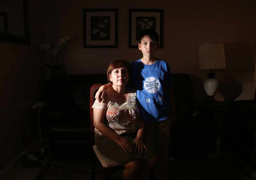 Dinorah Sierra and her son Daniel Sierra, 12, pose for a photograph at their home in Dallas. 