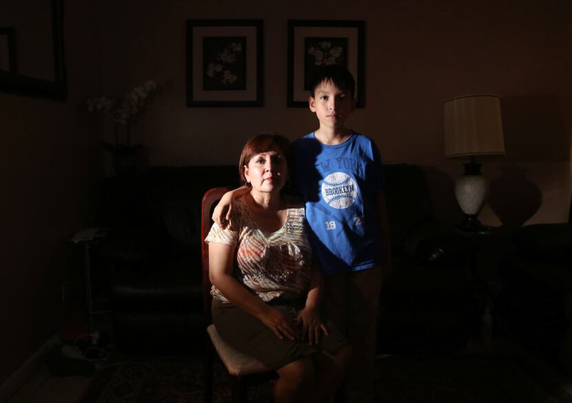 Dinorah Sierra and her son Daniel Sierra, 12, pose for a photograph at their home in Dallas. 