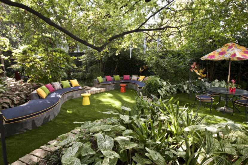 Can you spot the fakes in Norma  Glass' backyard? The lush green grass and ivy-cloaked fence...