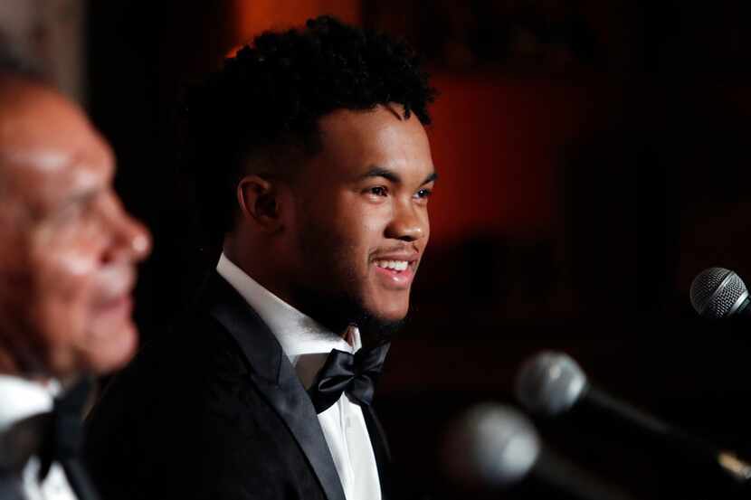 Heisman Trophy winner quarterback Kyler Murray, right, smiles during the Davey O'Brien Award...