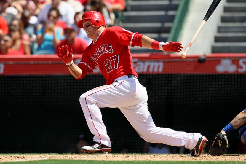 Mike Trout #27 of the Los Angeles Angels of Anaheim hits an RBI single in the seventh inning...