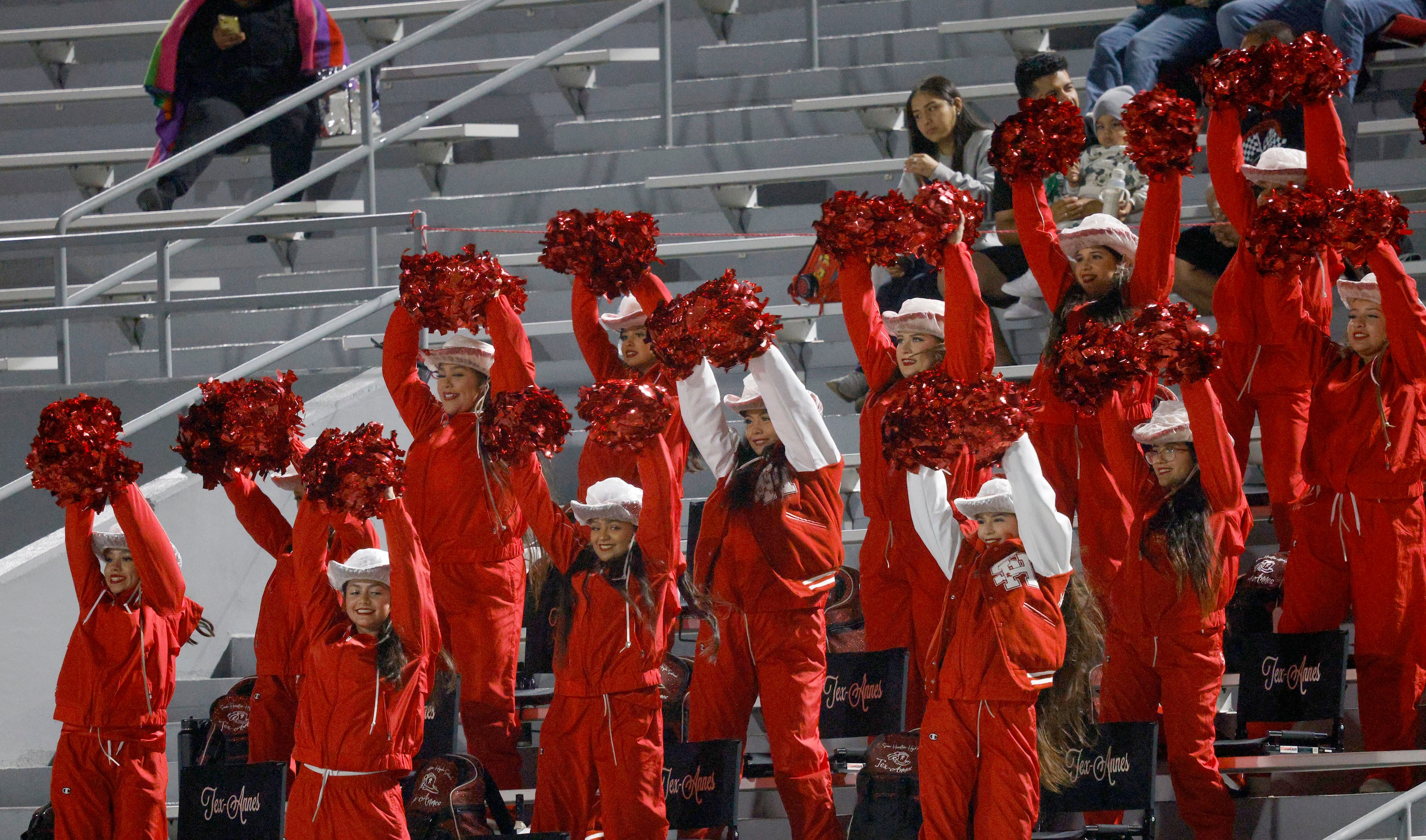 Sam Houston High School Tex-Annes Drill Team perform in the second half of a high school...