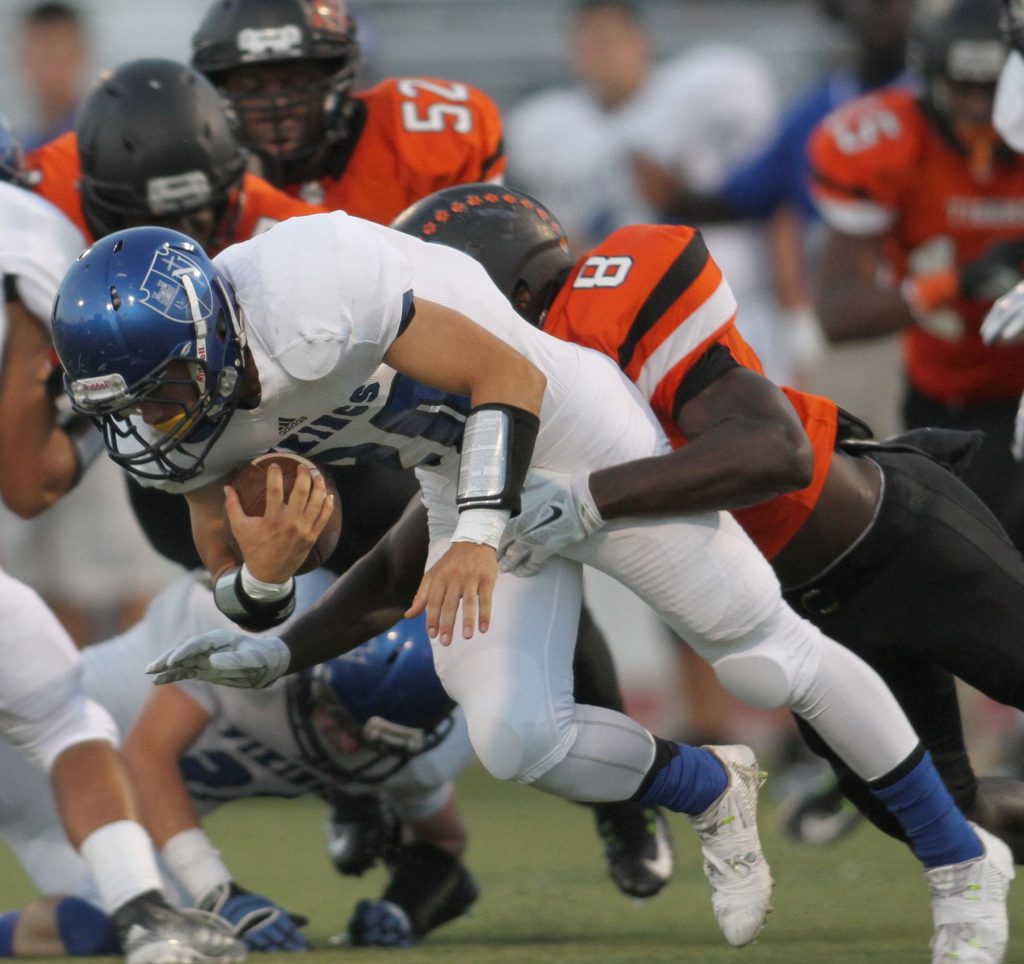 Fort Worth Nolan running back Brenden Farley (20) is stopped after a short gain by Lancaster...