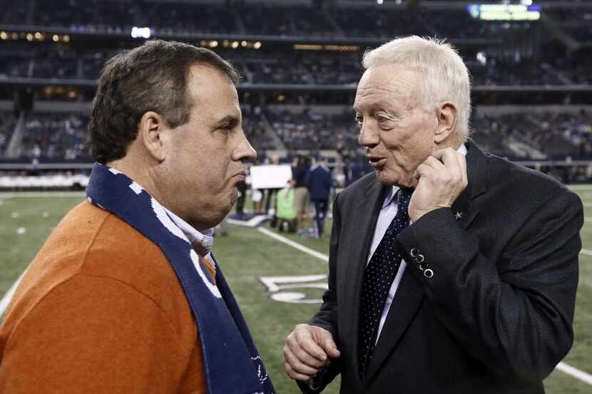  New Jersey Gov. Chris Christie, left, talks with Dallas Cowboys team owner Jerry Jones, as...