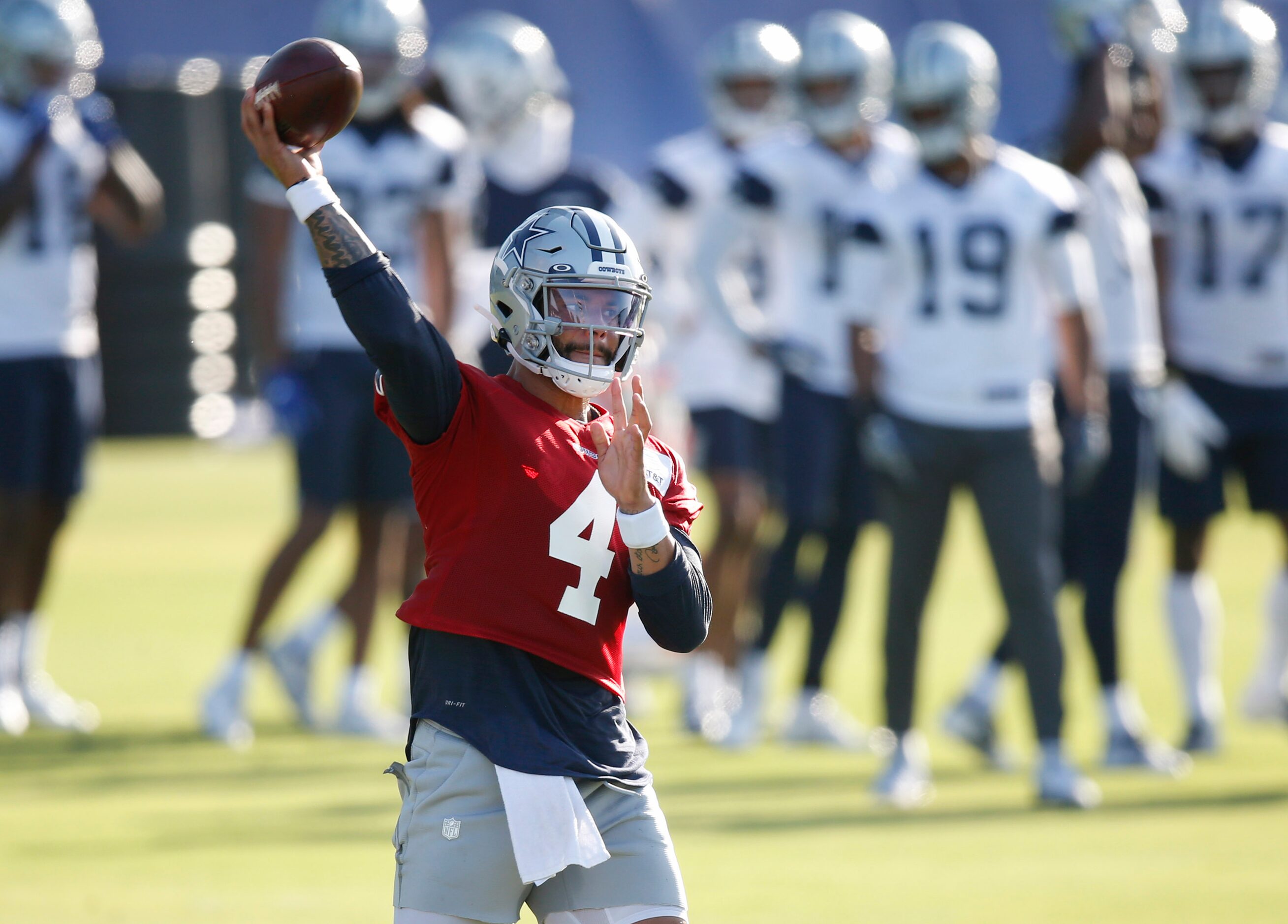 Dallas Cowboys quarterback Dak Prescott (4) throws the ball during the first day of training...