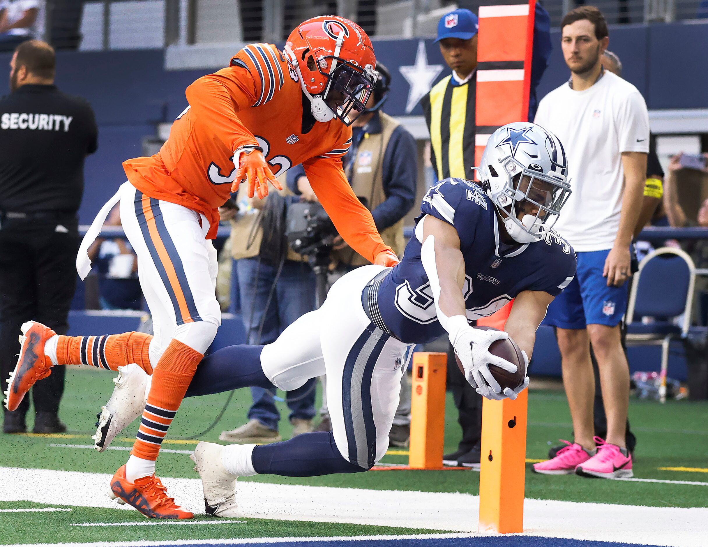 Dallas Cowboys running back Malik Davis (34) reaches across the goal line for a would-be...