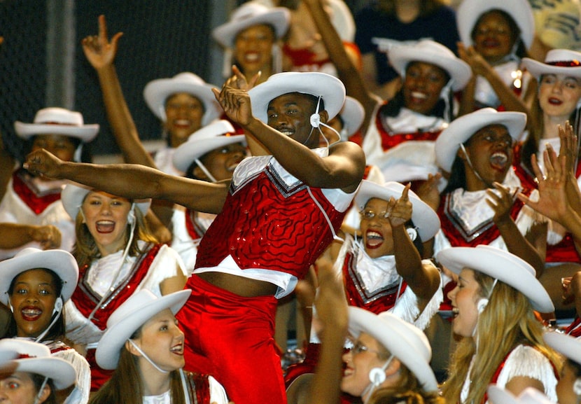 Cedar Hill High School Highsteppers drill team member George Lander Jr. (center), 16, did a...