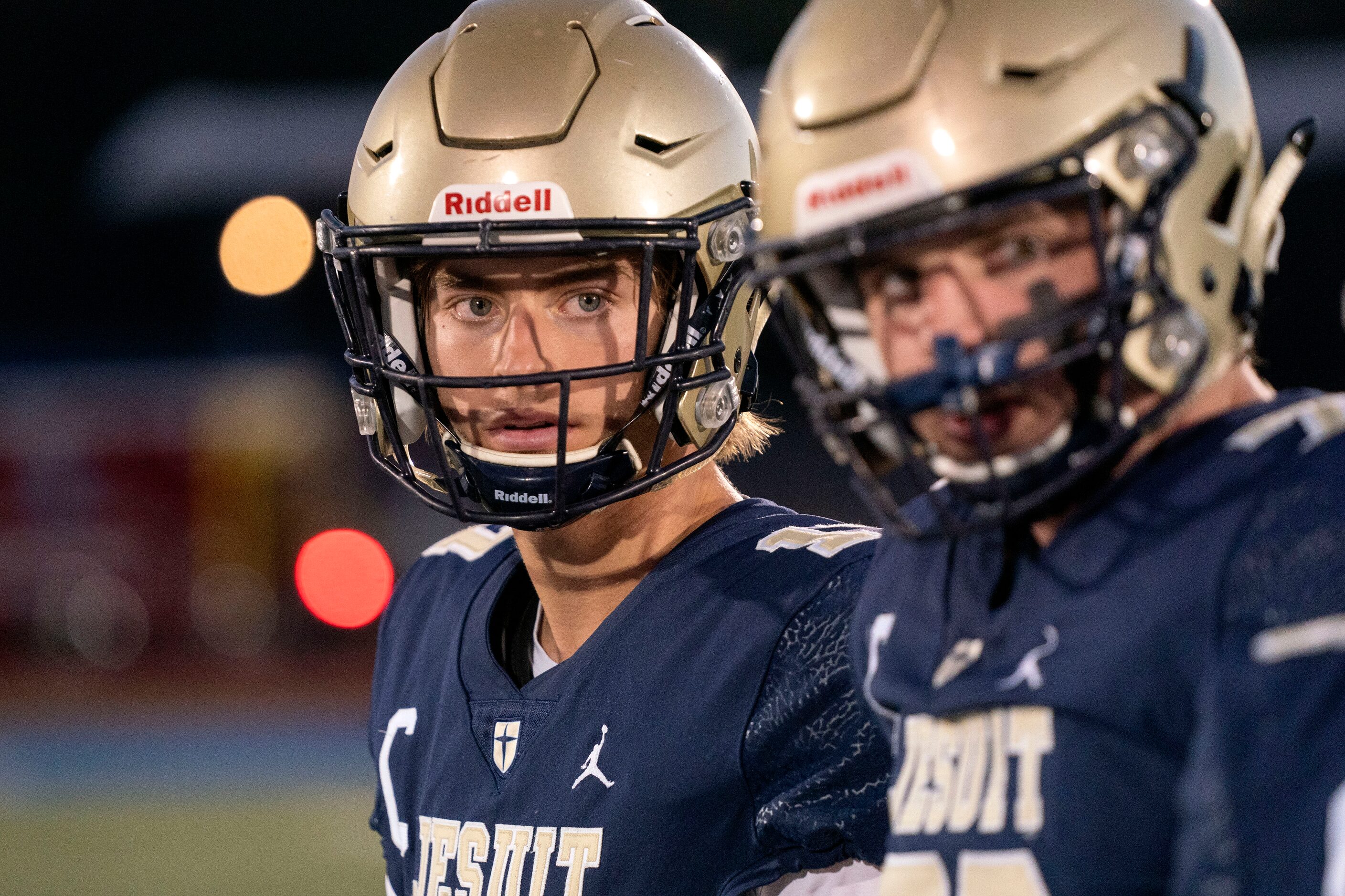 Jesuit senior quarterback Gage Roy (17), left, and senior offensive lineman Matthew...