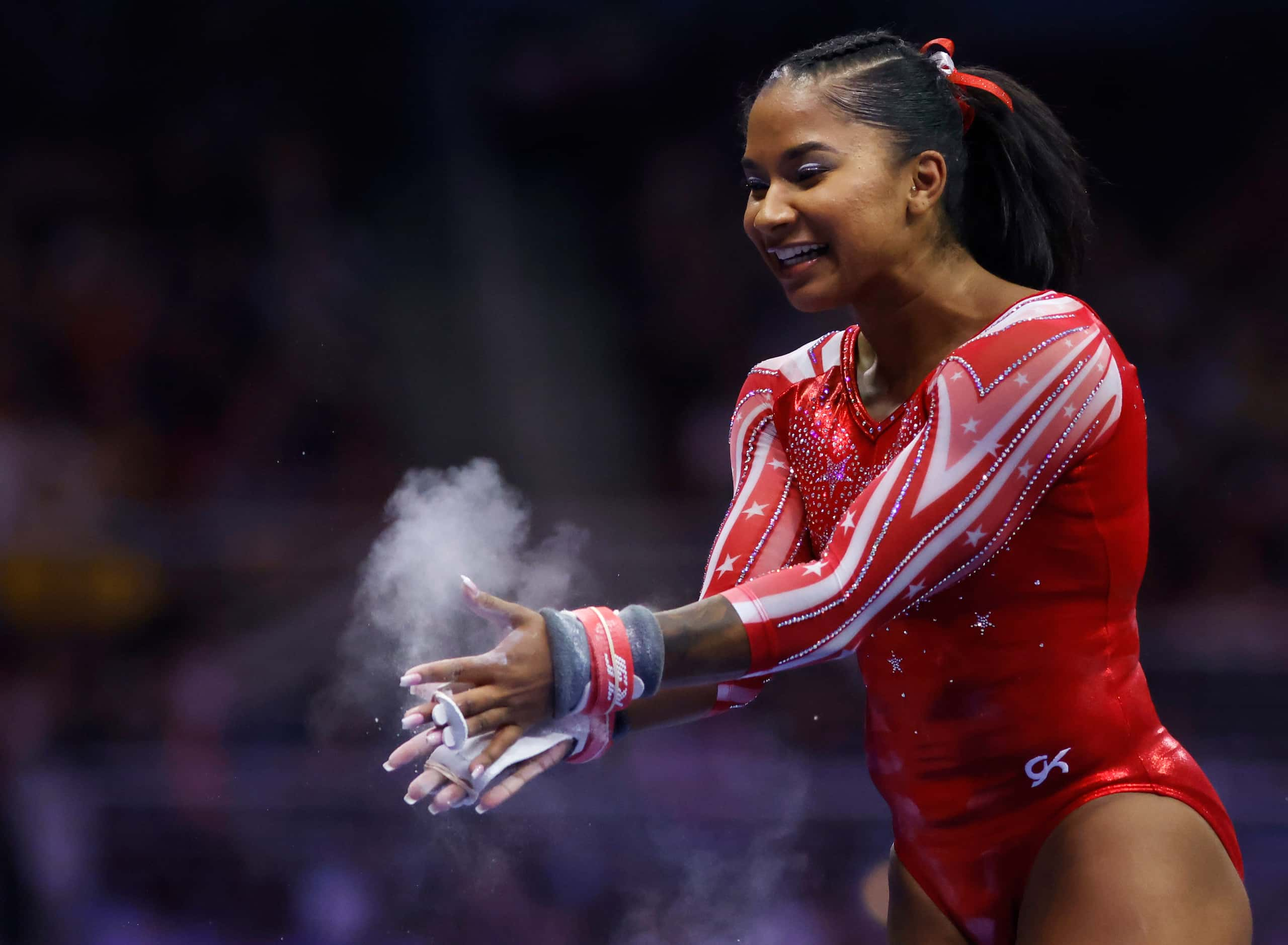 Jordan Chiles celebrates after finishing on the uneven bars during day 2 of the women's 2021...