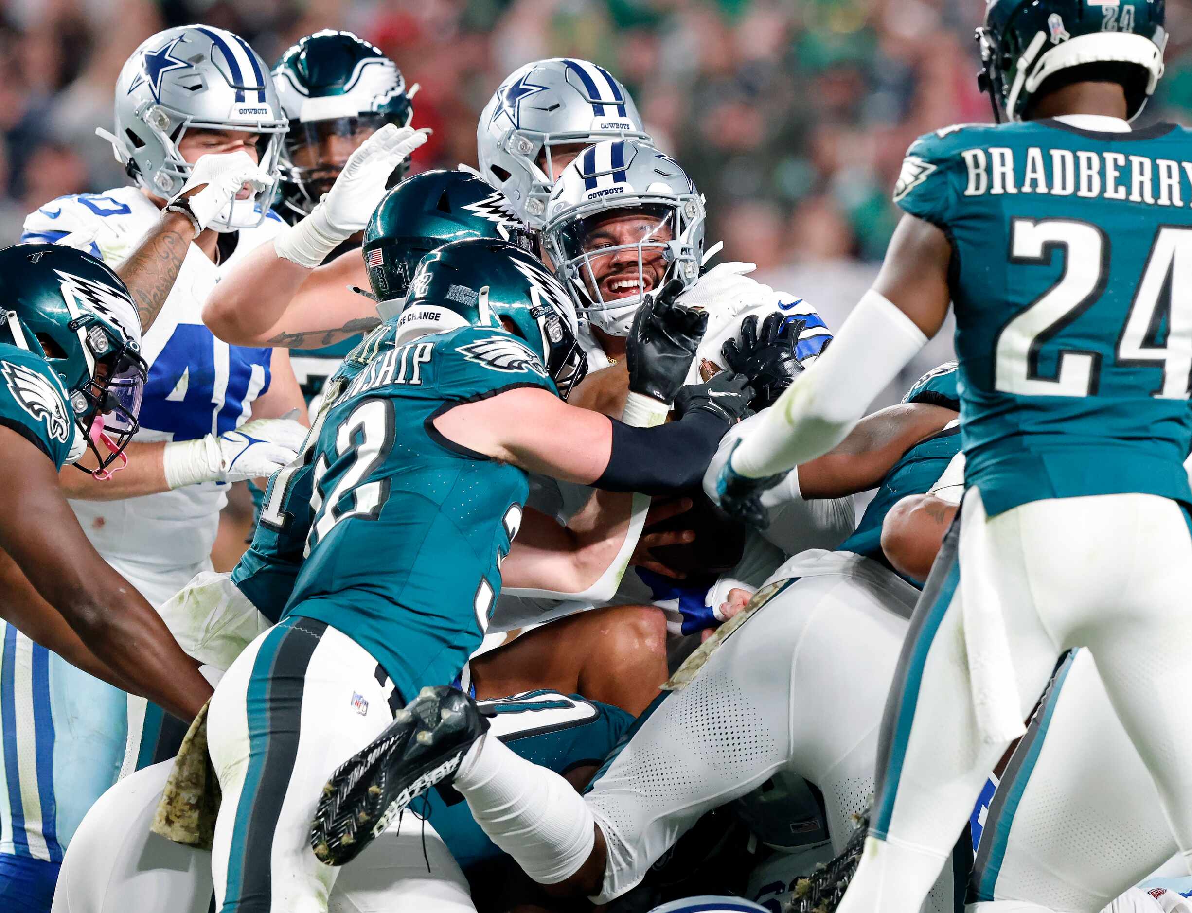Dallas Cowboys quarterback Dak Prescott (4) pushes his way through the Philadelphia Eagles...