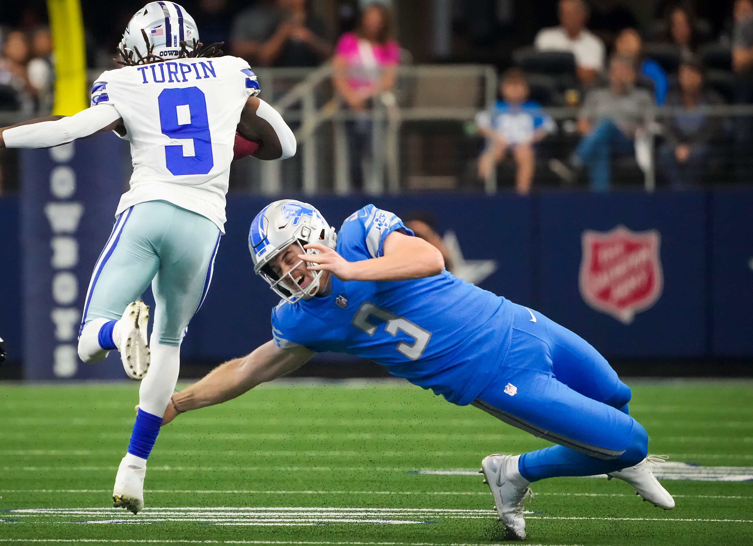 Dallas Cowboys kick returner KaVontae Turpin (9) gets past Detroit Lions punter Jack Fox (3)...