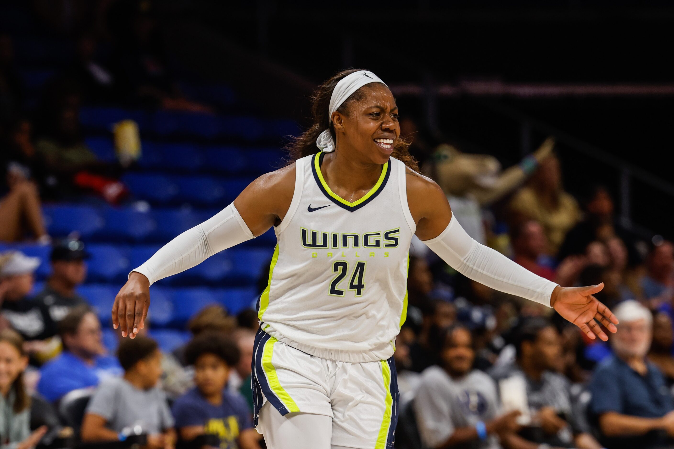 Dallas Wings guard Arike Ogunbowale (24) celebrates a 3-poinst against the Indiana Fever...