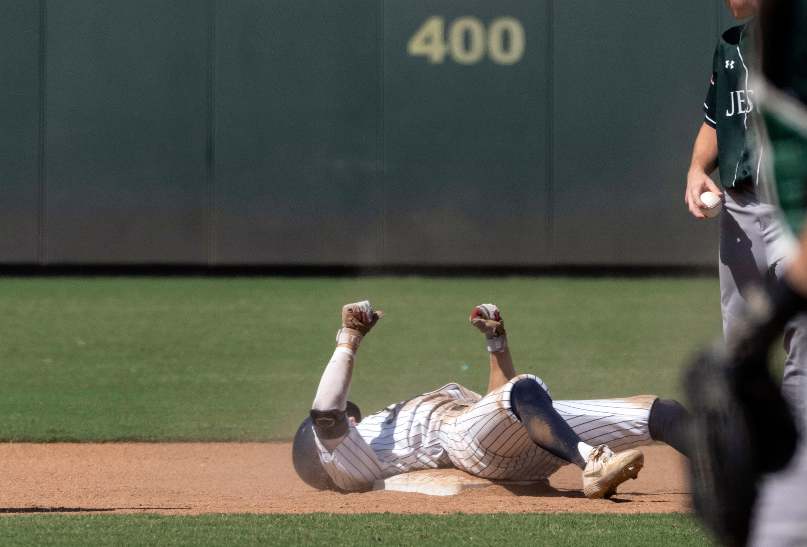 Keller Aidan Connors, (4), celebrates on second base after a RBI double against Houston...