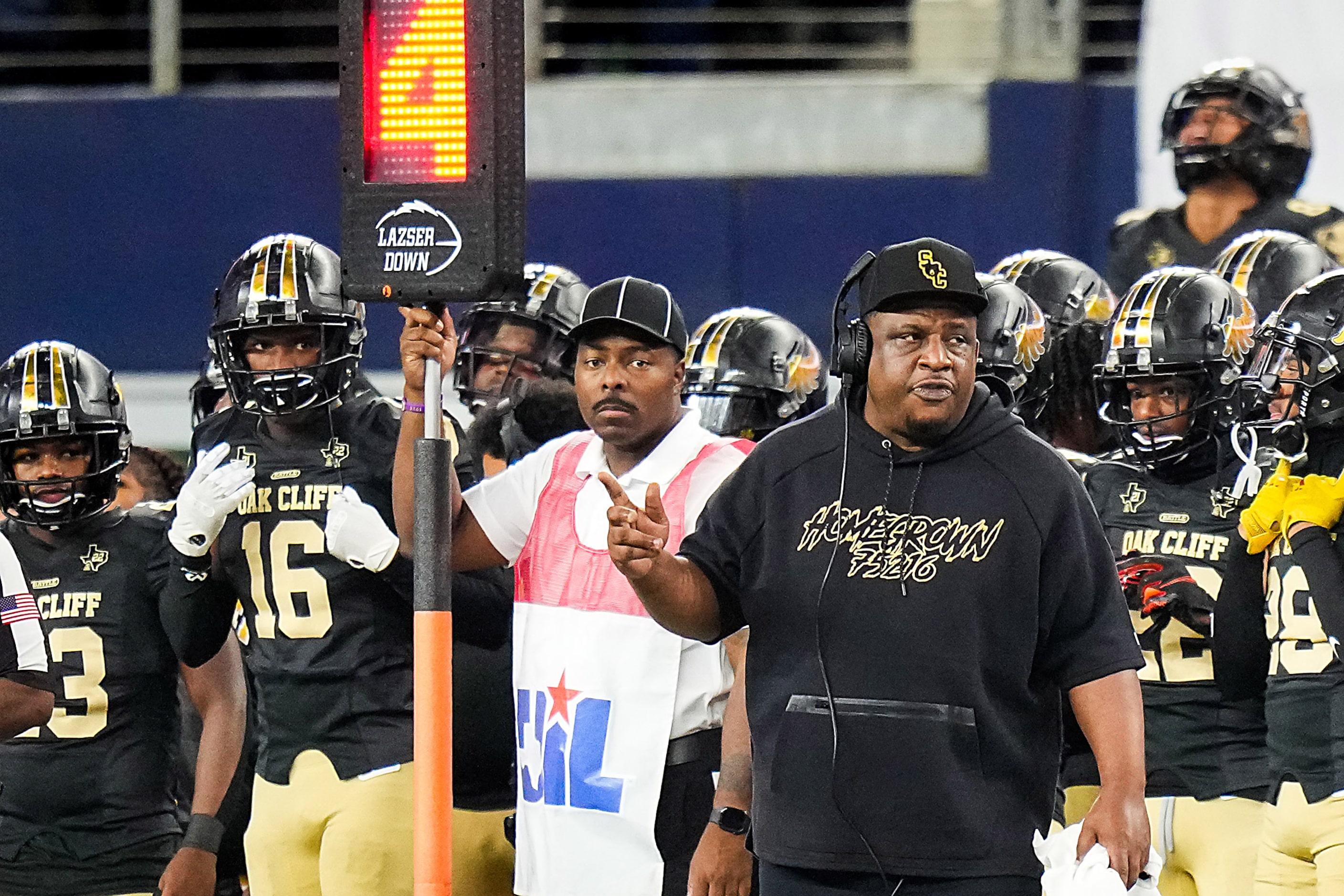 South Oak Cliff head coach Jason Todd motions to his team before going for it on a fourth...