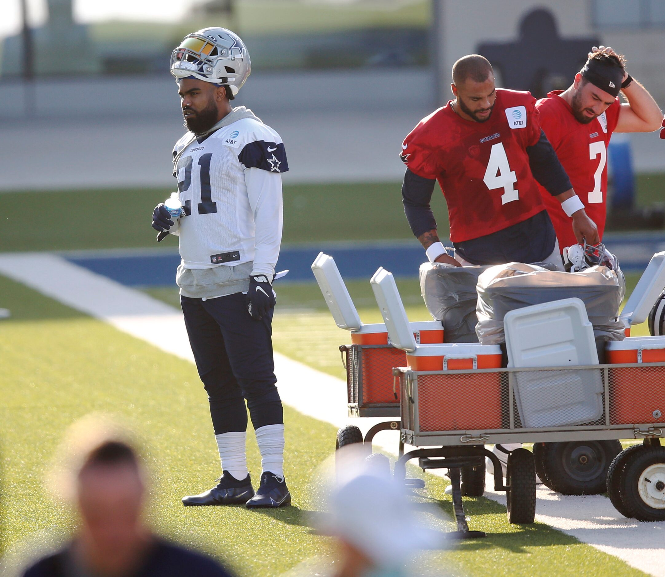 Dallas Cowboys running back Ezekiel Elliott (21) and Dallas Cowboys quarterback Dak Prescott...