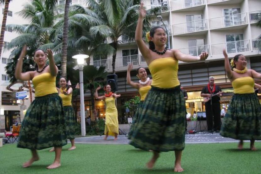 
Hawaiian music group Kekaniwai plays in the heart of Waikiki with hula dancers every...