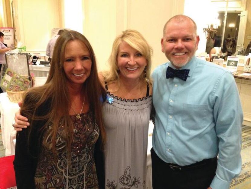 
Sarah Kammerer (left) of the DFW Humane Society, Lisa Sturgeon and Michael Whiteside at the...