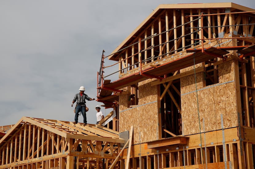 Workers frame new homes at the Toll Brothers Inc. Baker Ranch community development in Lake...