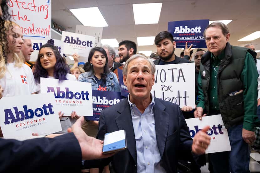 Texas Governor Greg Abbott speaks to the press following a Get Out The Vote event at Ben...