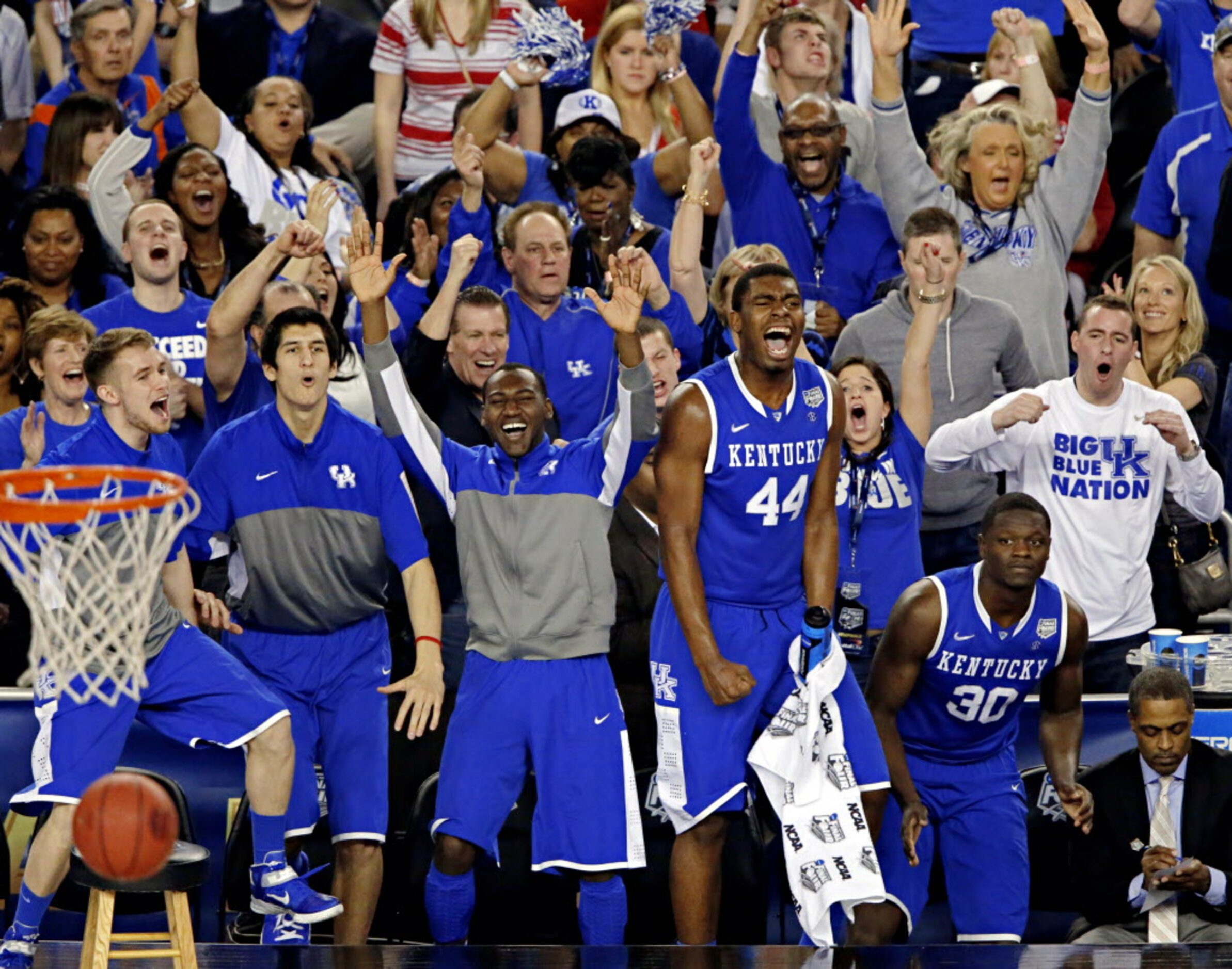 Kentucky Wildcats players react as they pull ahead of the Wisconsin Badgers during the...