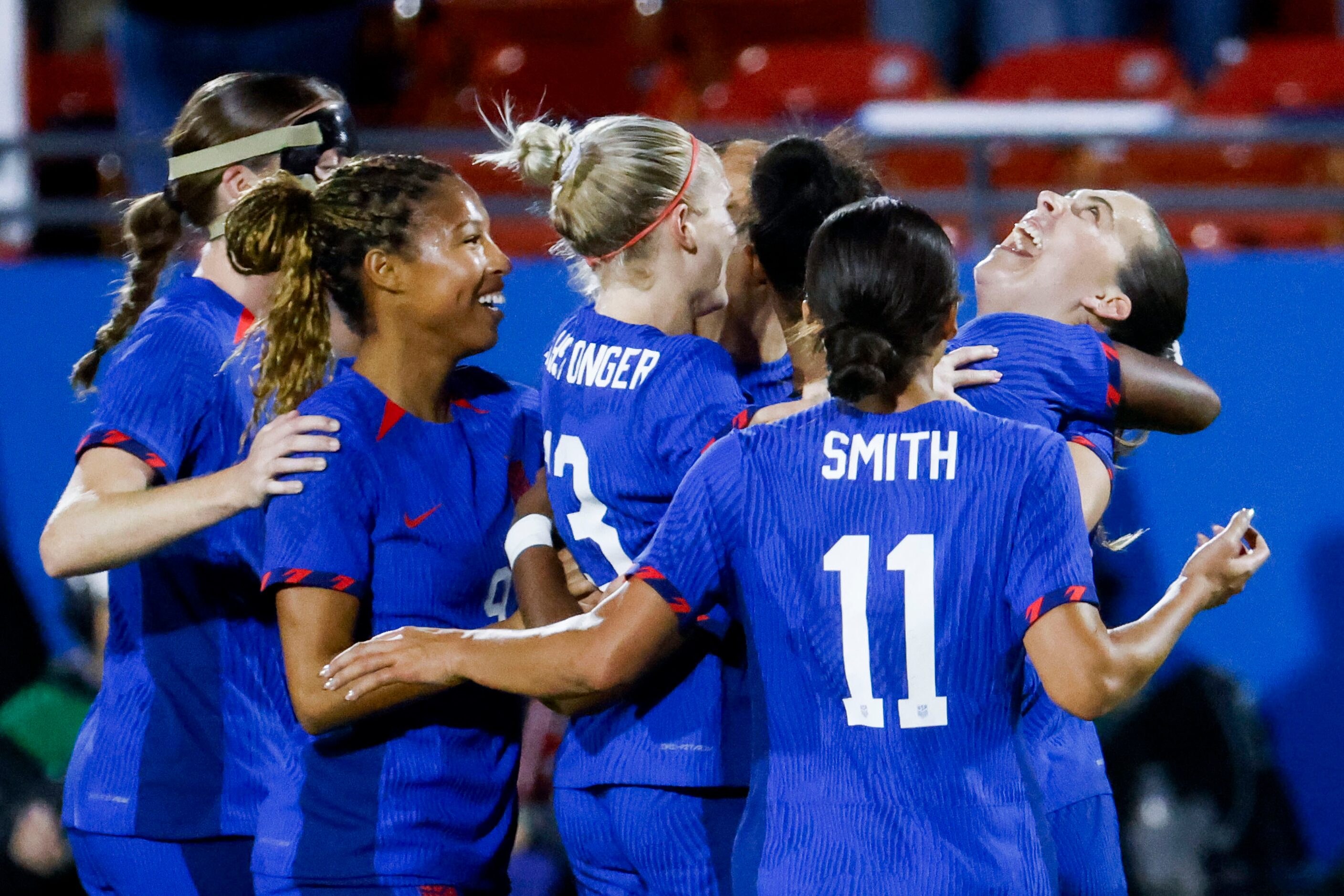 United States midfielder Sam Coffey (right) celebrates a goal her teammates during the...